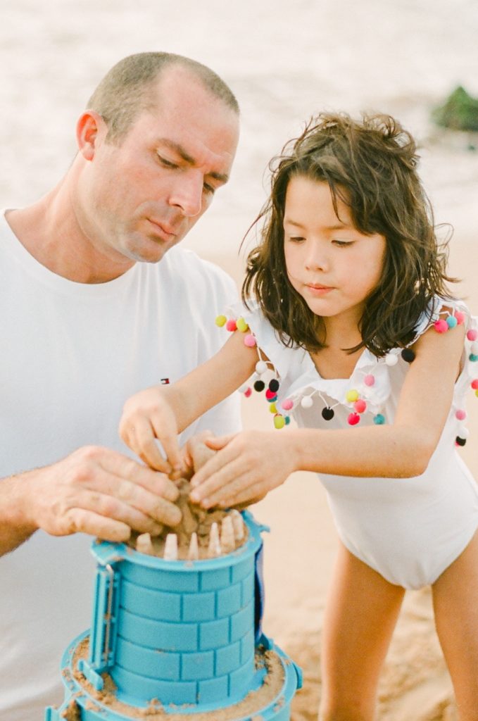dad and daughter having fun at their Maui family portrait session