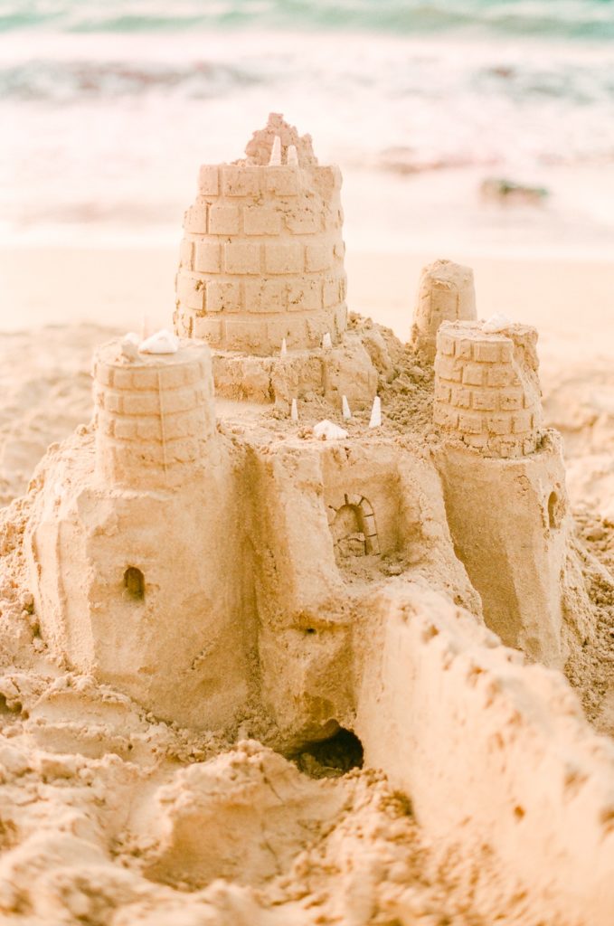 fun and stress free Maui family photography session with sandcastle building activity