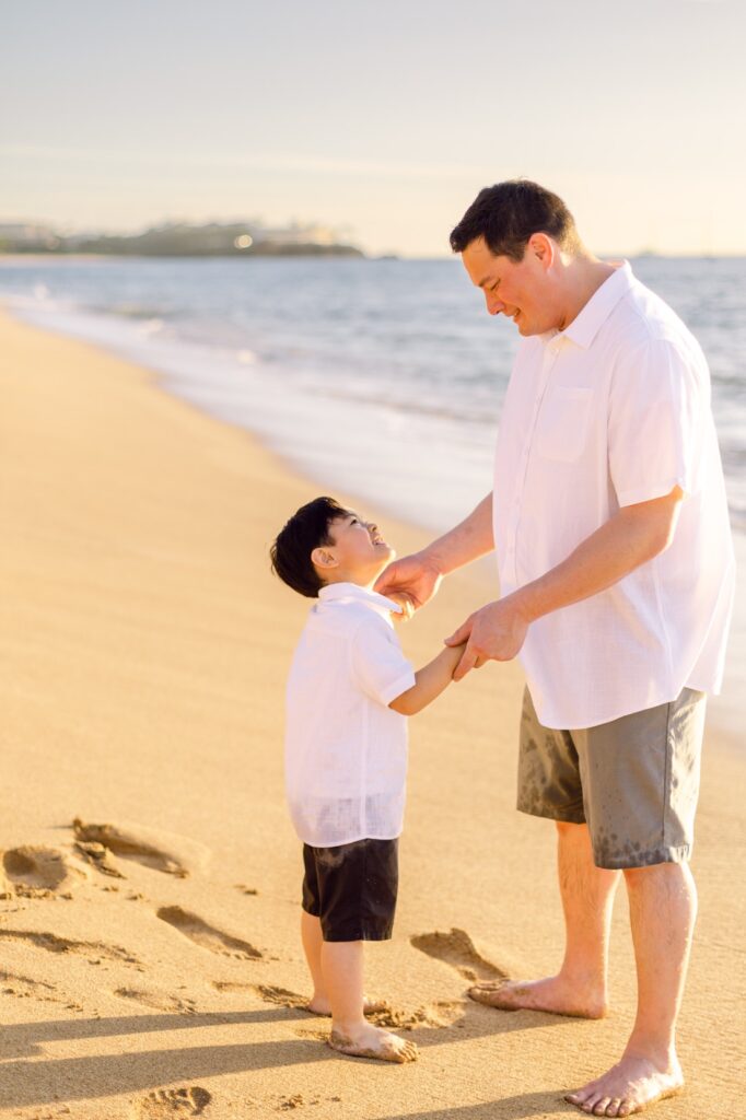 dad and son at beach for sunset  sunset family photos