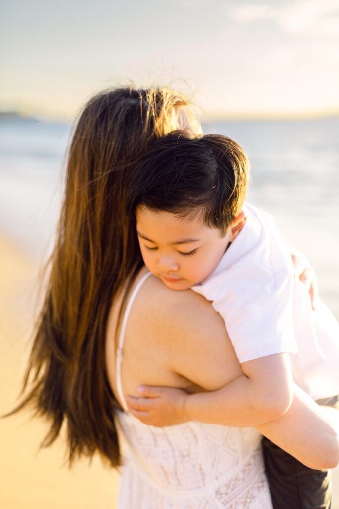 Lahaina Kahekili Beach family photos mother and son embrace