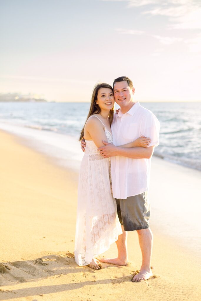 Couple posing at sunset on the beach on Maui