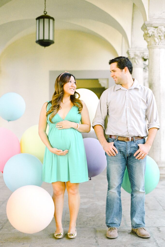 baby bump parents to be session Maui with pastel balloons
