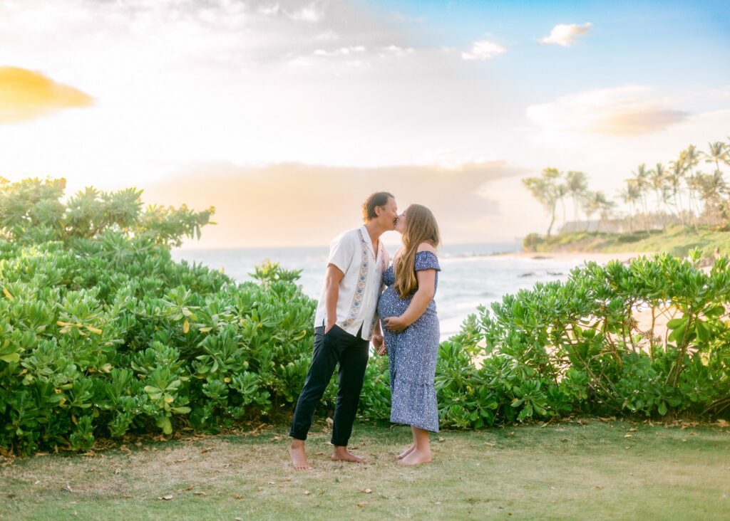 Sunset maternity portraits on the beach at Andaz Maui during a babymoon trip