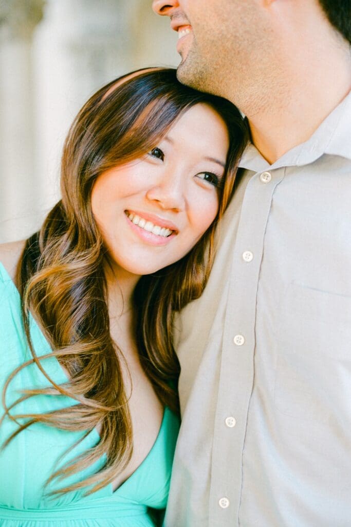 Maui maternity photos of pregnant woman resting against husband's shoulder