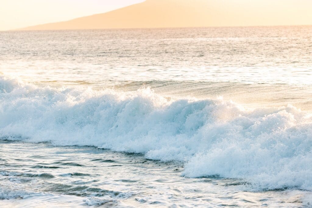 Detail shot of strong shore break for ocean safety tips on Maui babymoon 