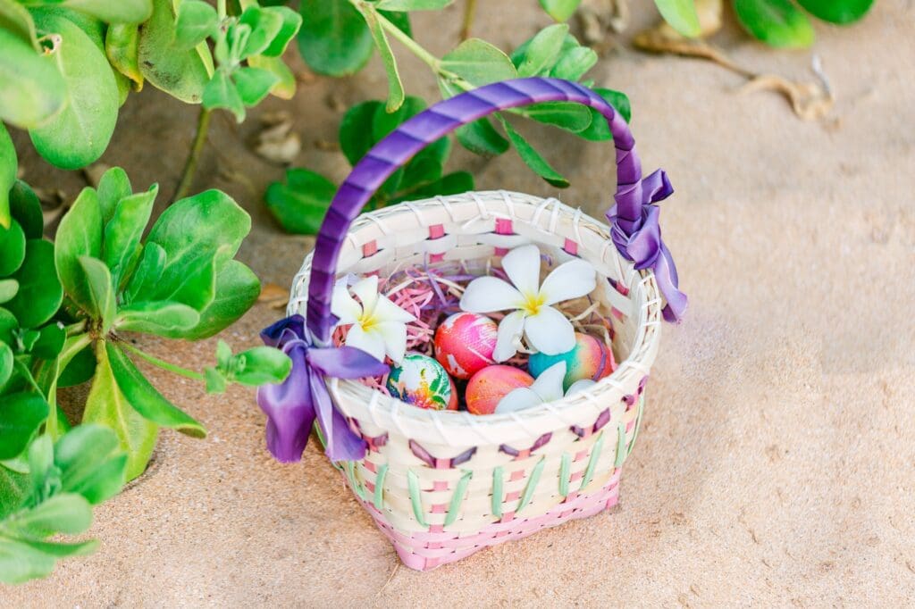 easter basket with tie-dye eggs on sand for Maui beach easter egg hunt
