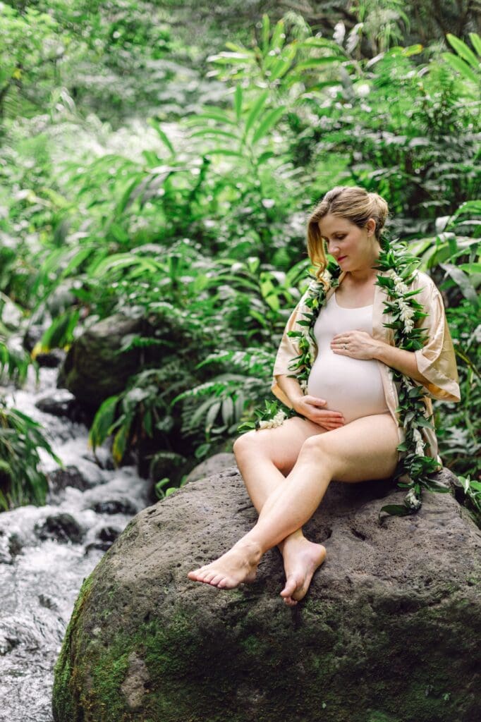 Tucked-away waterfall and ginger-lined path during a Maui maternity photographer session at ‘Īao Valley.
