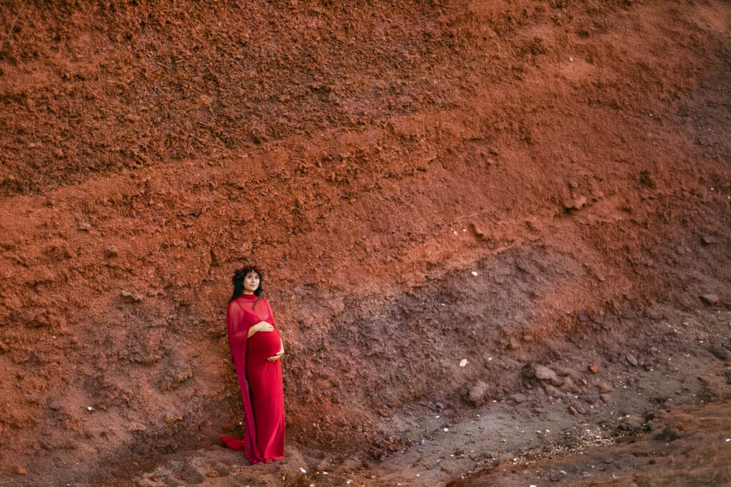 Maui maternity photography at Black sand beach Maui volcanic texture red cinder cone cliffs