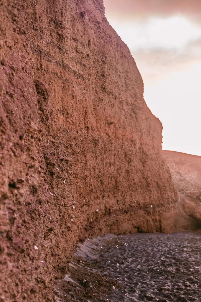 red cliffs at maui black sand beach makena