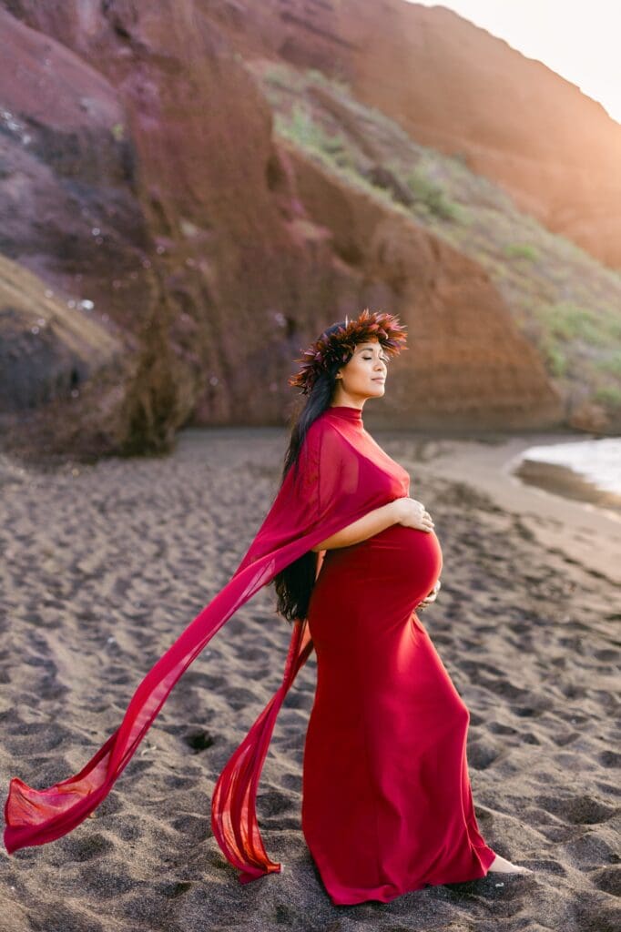 Maui maternity photographer burgundy gown flowing fabric ocean wind 