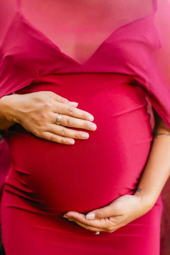 close up of belly for Maui maternity photography at black sand beach