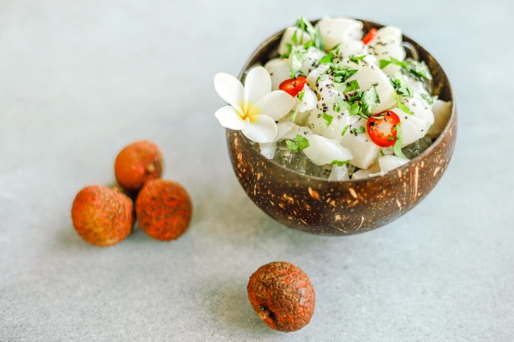 Healthy bowl of fresh fish and fruit with lychee on Maui
