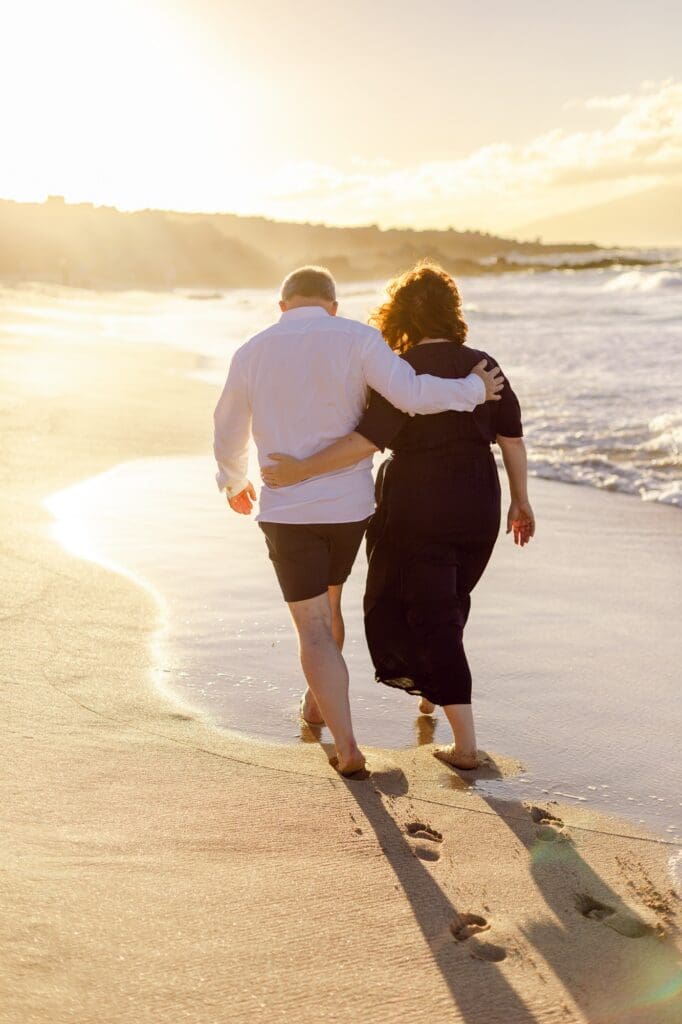 anniversary trip to maui photo walking on beach during sunset