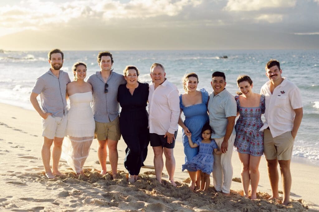 maui extended family large group photography session on beach during sunset